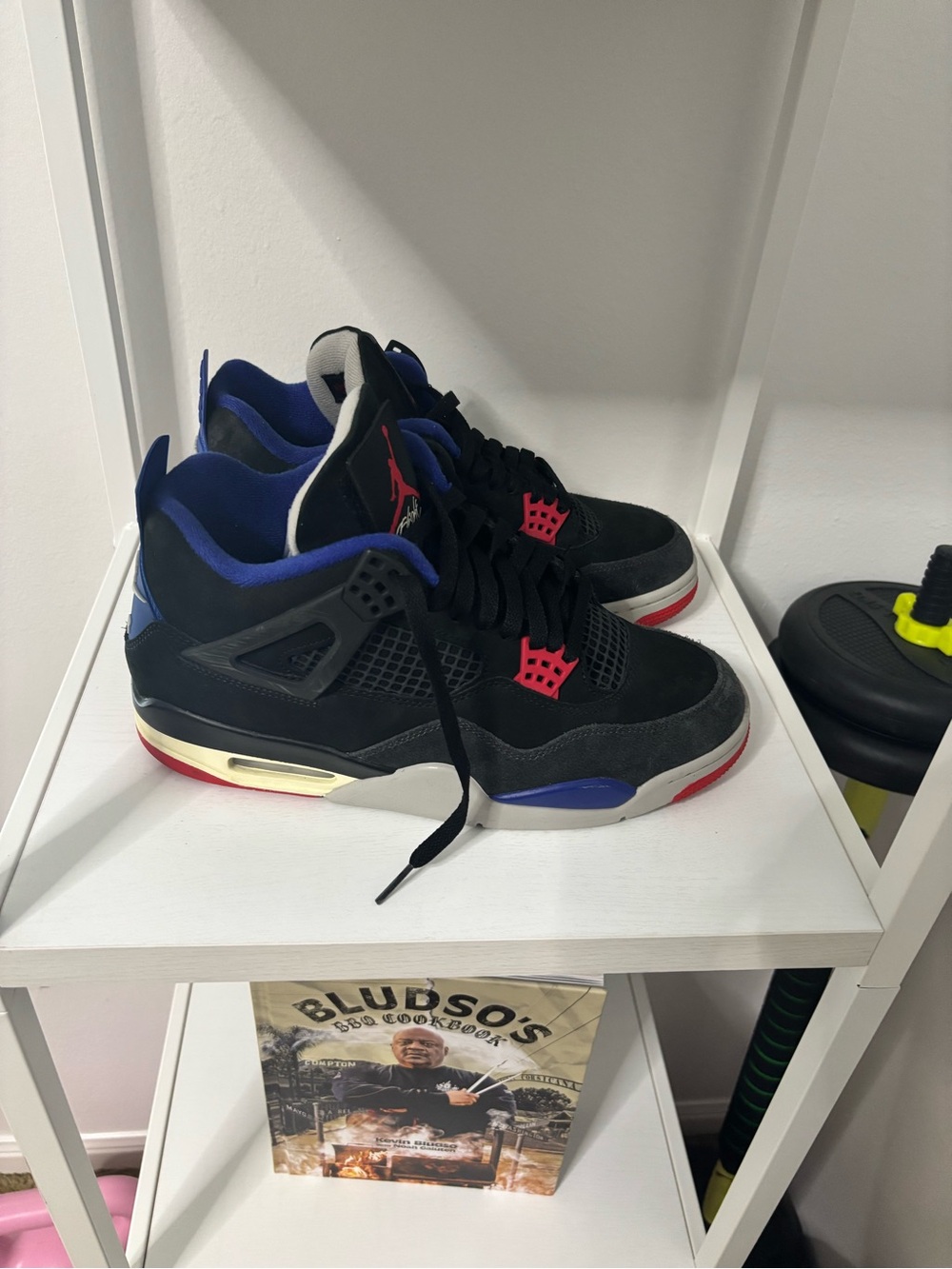 Jordan 4 Black Sneakers with Blue and Red Accents